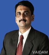 Dr. Tilak Suvarna